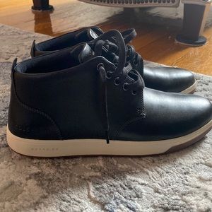 Black Cole Haan sneakers.